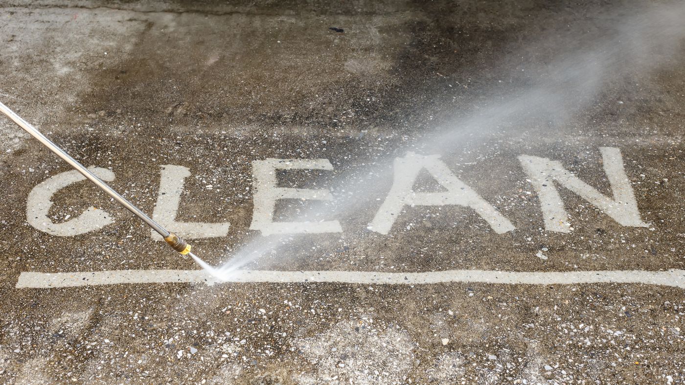 Pressure washing reveals clean concrete